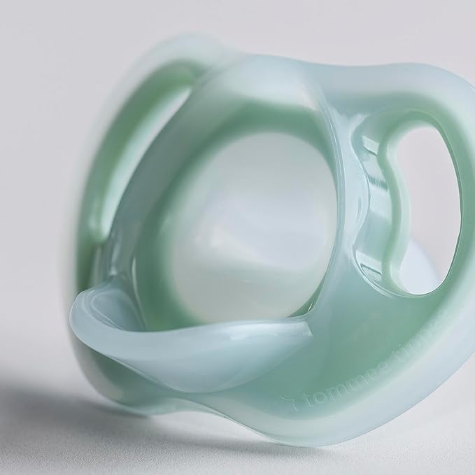 Tommee Tippee Ultra-Light Silicone Pacifier, 6-18 Months, Symmetrical One-Piece Design, BPA-Free Silicone Binkies, Clear/Blue/Yellow, Pack of 4