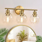 Indoi 3-Light Bathroom Light Fixtures, Brushed Gold Modern Vanity Lights Over Mirror with Clear Glass Globe Shade, Bathroom Wall Sconces for Mirror Kitchen Living Room Hallway Cabinet Bedroom Porch