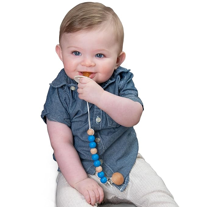 White-Sweet Jill Pacifier Clip Made with Silicone Beads and Secured with Wood Clip. 1 Piece Design. BPA-Free. Chewable. 9" Long. Keeps Pacifiers and teethers securely Fastened.